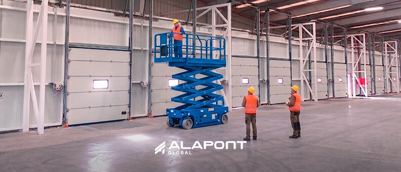 Sectional industrial doors installed in a loading bay with compliant maintenance plan